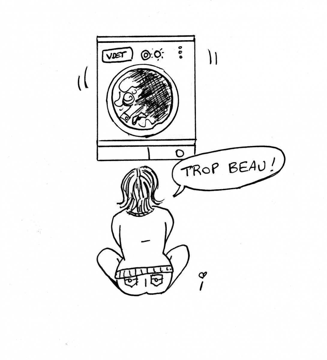 Femme devant machine à laver